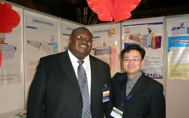 CEO with supplier at trade show